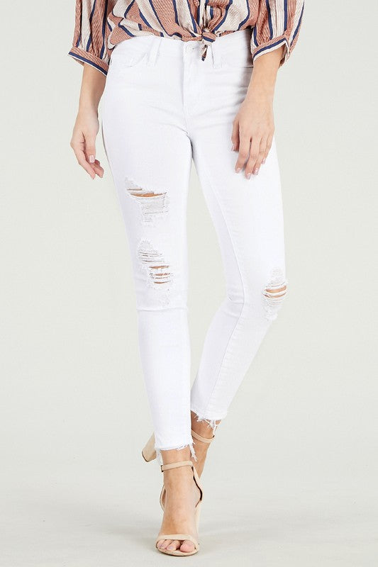 Mid Rise destroy hem cropped skinny jeans